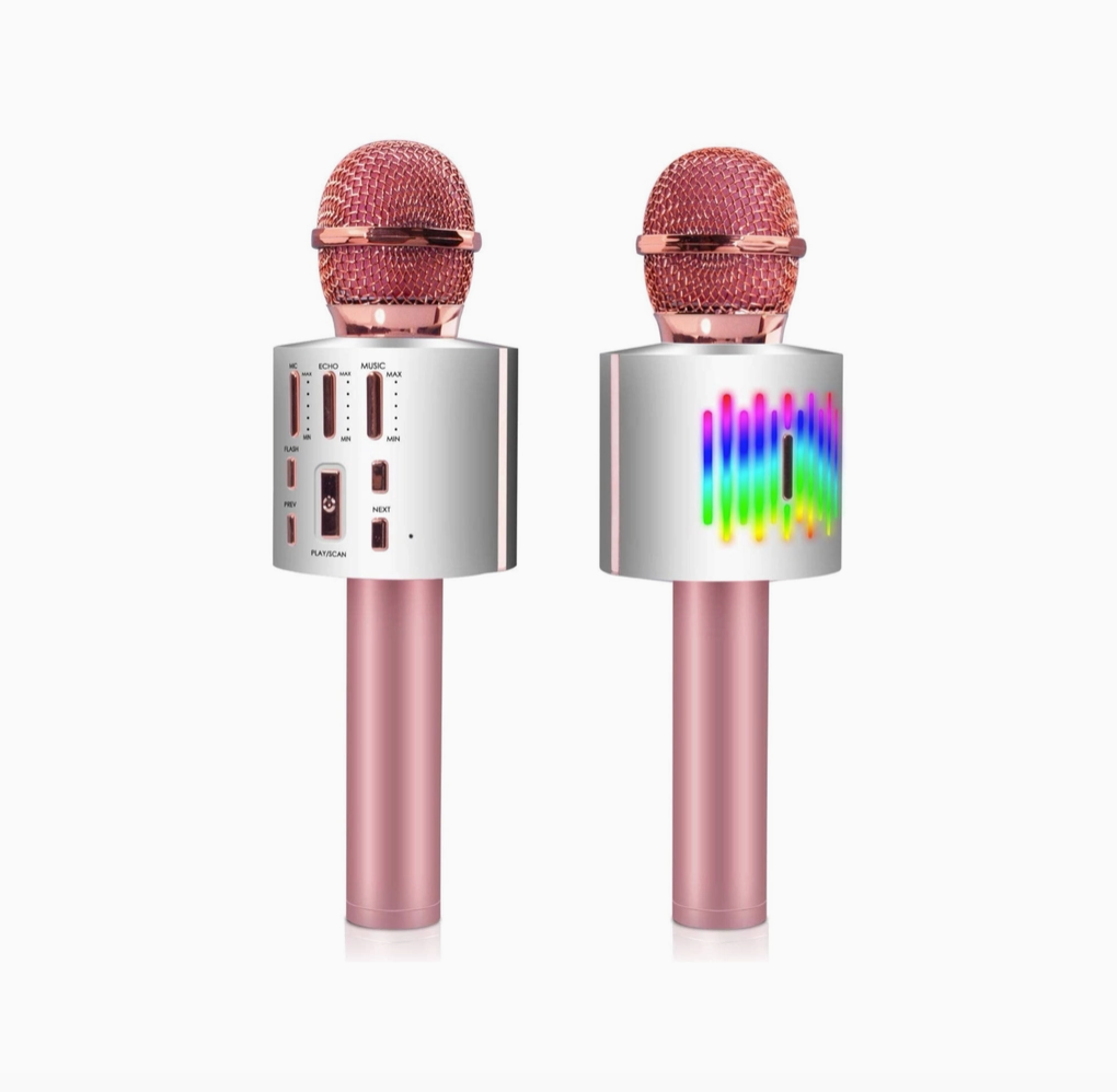 Two rose gold microphones on a white background.