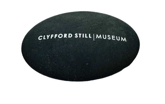 Black Pebble Eraser with Clyfford Still Museum logo.