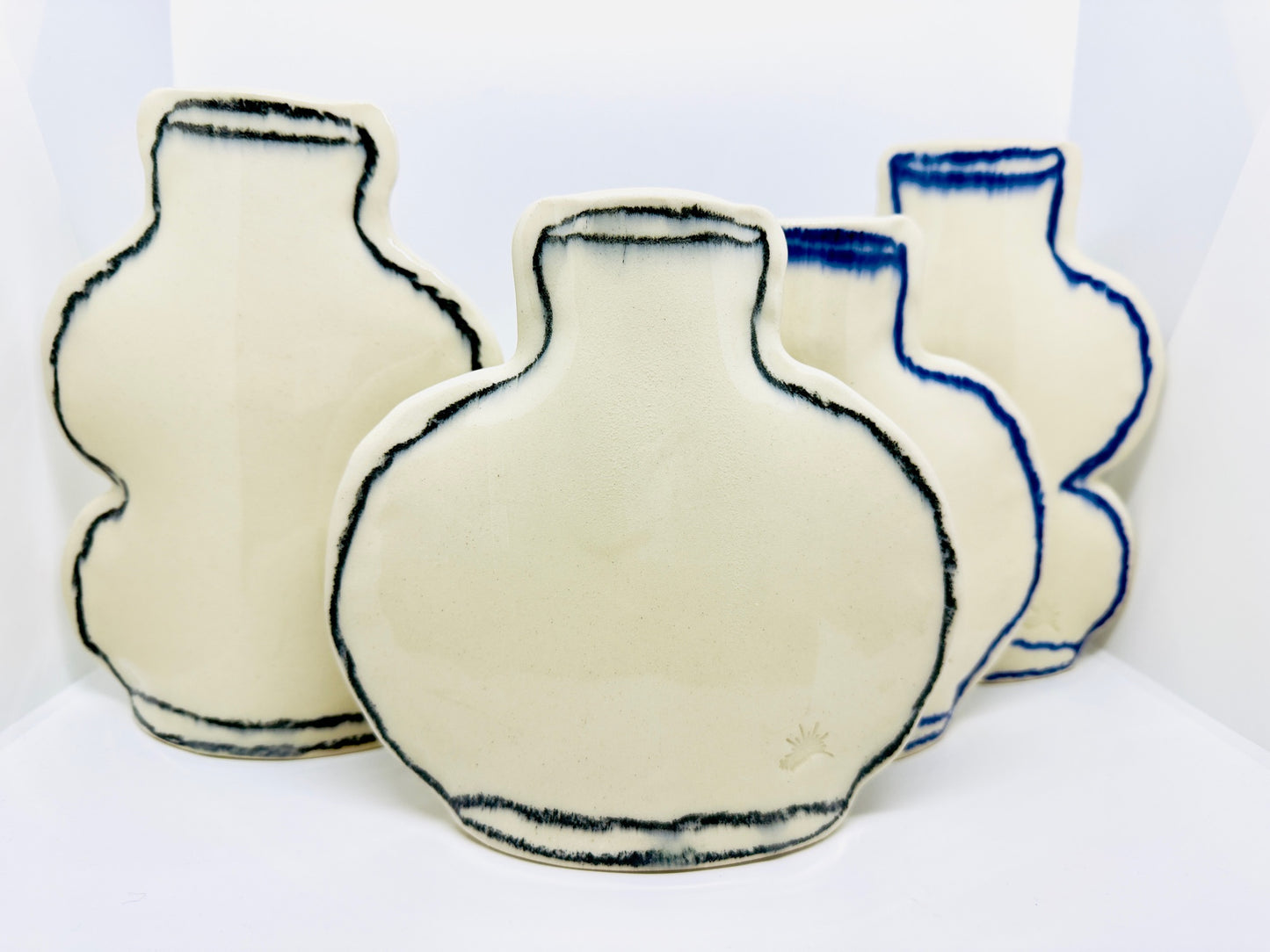 Photograph of all cedar sun ceramic variants.