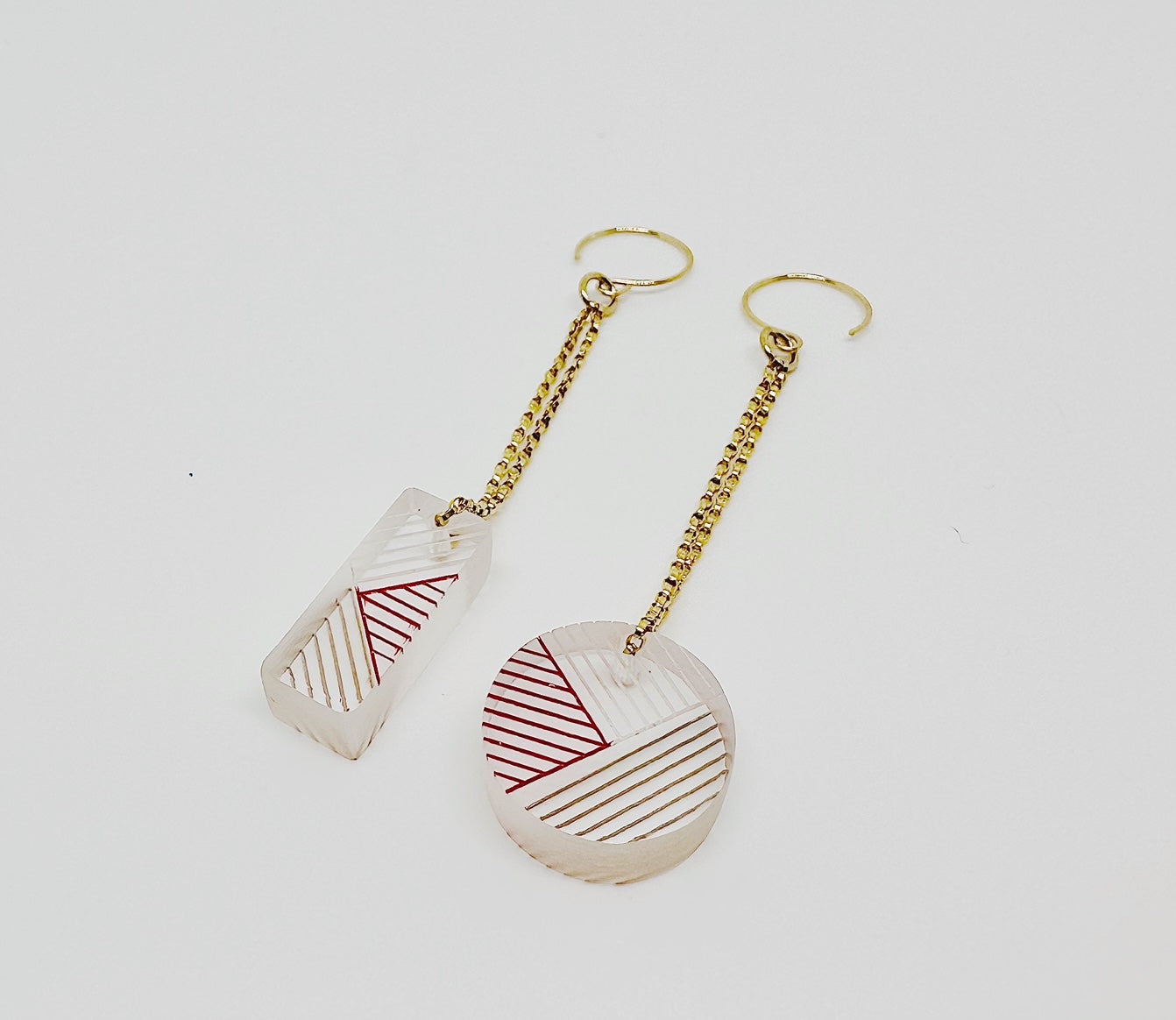 Osa/Oda Earrings (Mis-Matched Geometric Dangle) - one set. Transparent handpainted acrylic, dangling from gold-fill {g} Rolo chain. Measure approximately .5” w x 3.5" l with chain. 