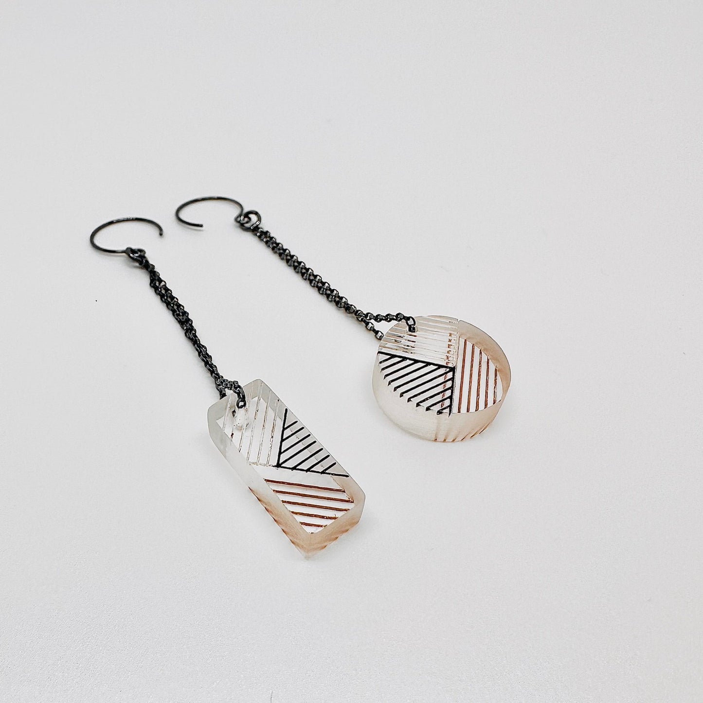 Osa/Oda Earrings (Mis-Matched Geometric Dangle) - one set. Transparent handpainted acrylic, dangling from oxidized sterling silver {s} Rolo chain. Measure approximately .5” w x 3.5" l with chain. 

