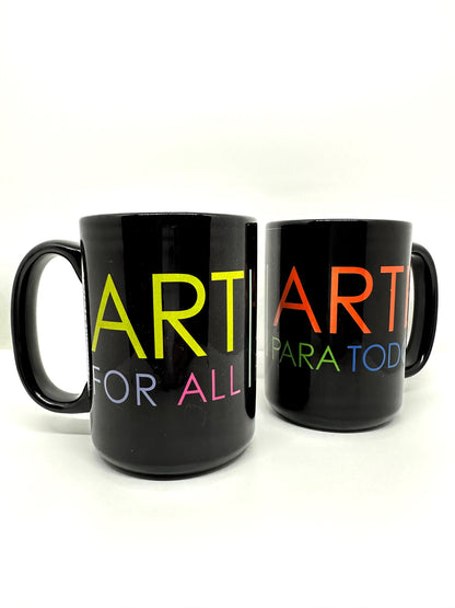 Two black mugs with the colorful words; “ART FOR ALL|ARTE PARA TODOS.”