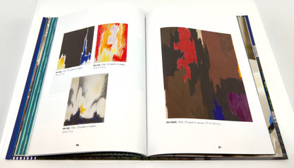 Open book displaying abstract art illustrations on a white background