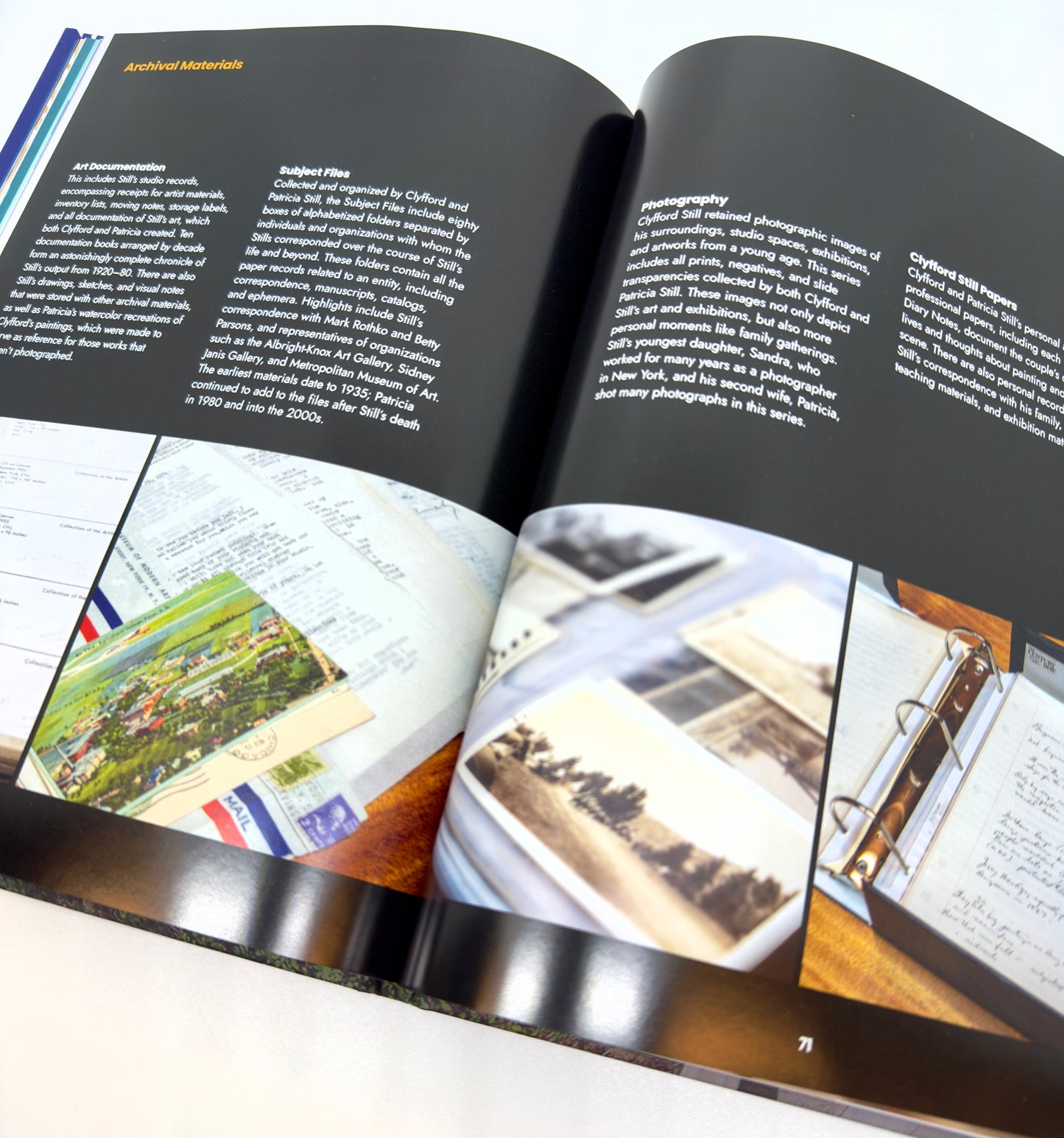 Open book with photographs and text on a white background