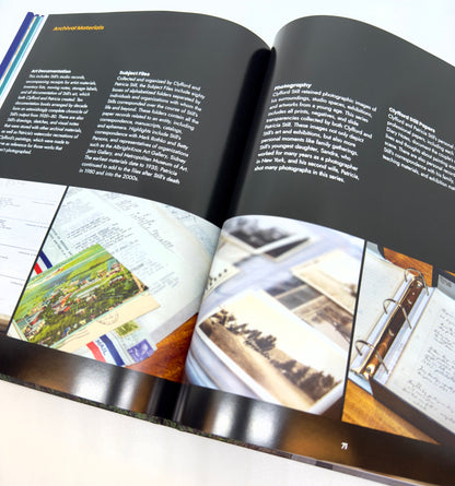 Open book with photographs and text on a white background