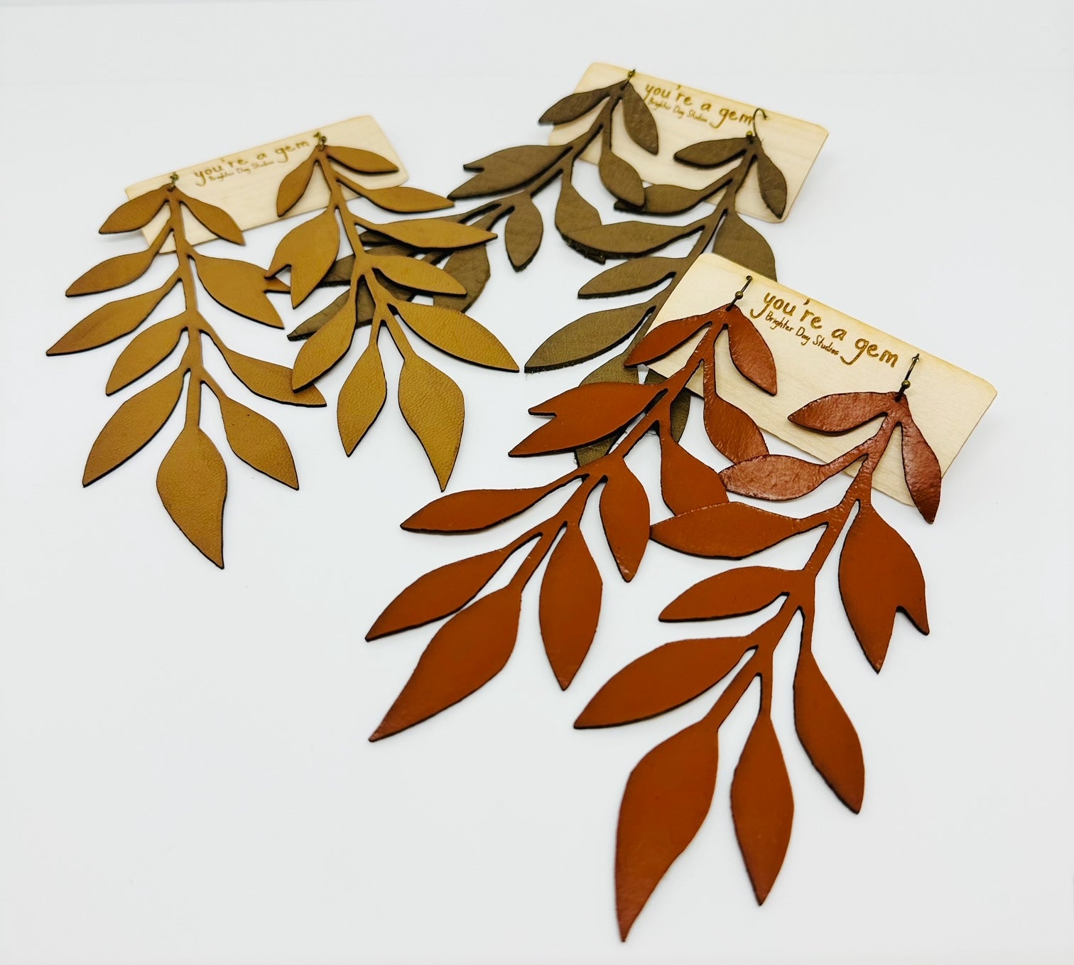 Three color options of the Leaf Leather Earrings