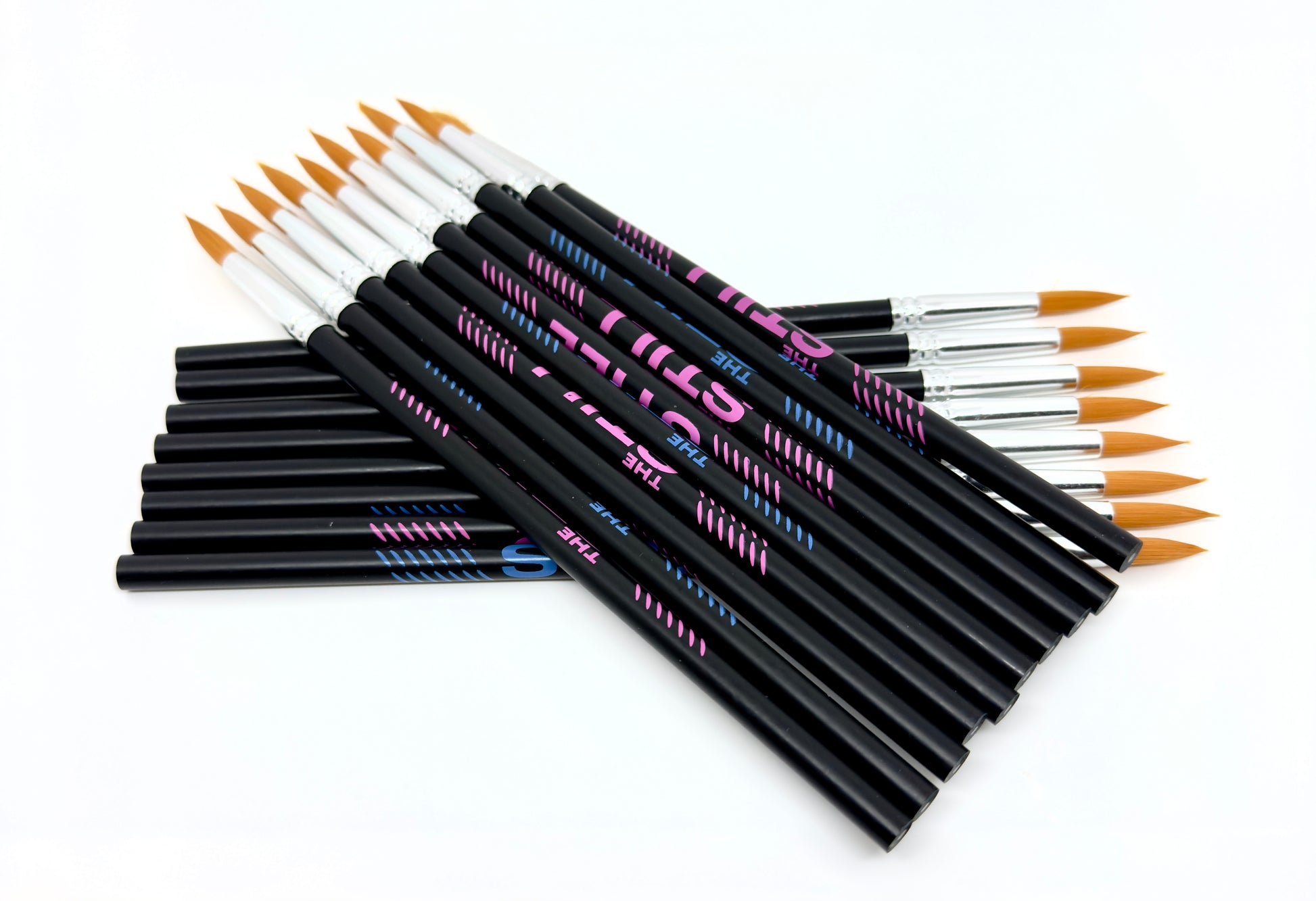 Multiple "The Still" branded pencils with paint brushes on one end