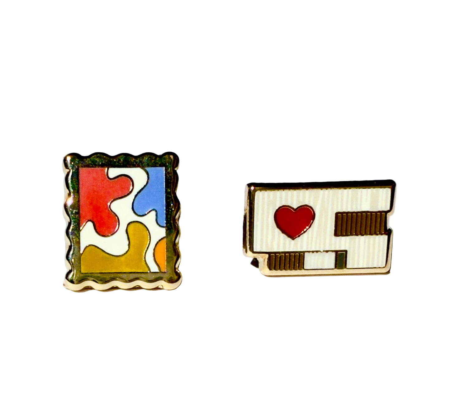 Enamel earrings of the Clyfford Still Museum building and a painting