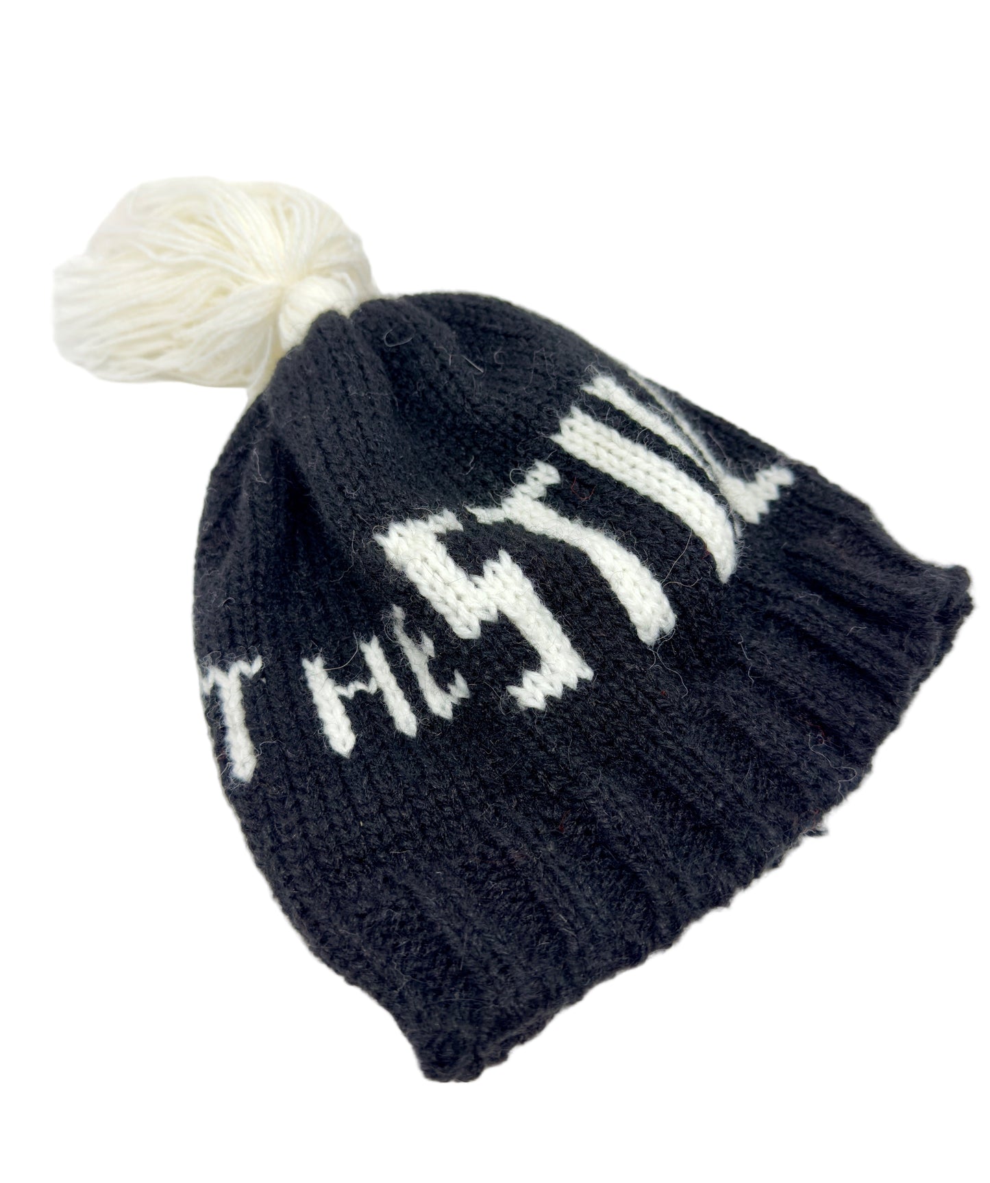 Black knit beanie with white museum logo and pom-pom on a light background.