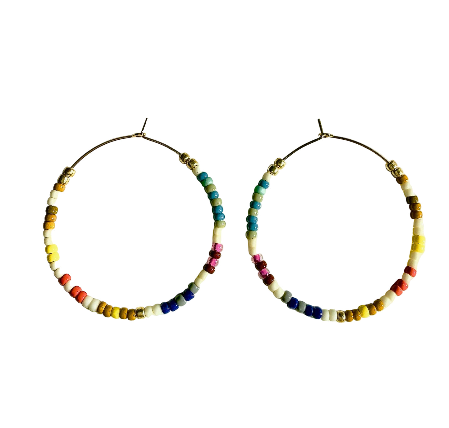 Pair of hoop earrings with colorful beads on a light background