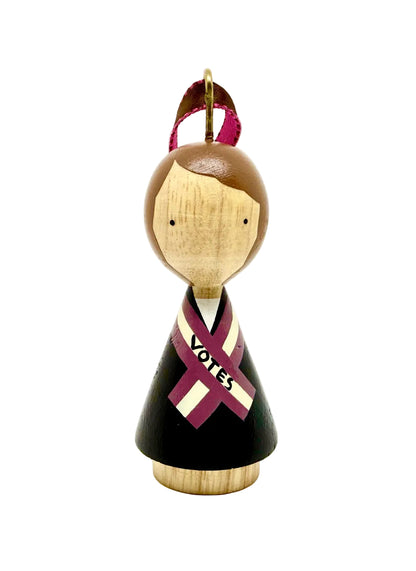 Wooden peg doll with a suffragette ribbon on a white background