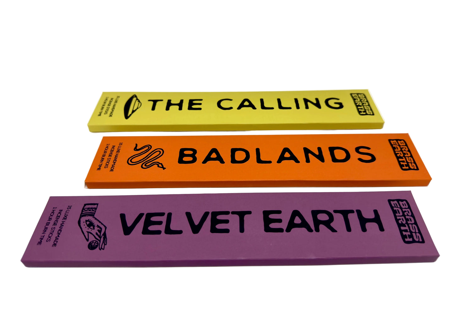 Three colorful rectangular packages of incense with text 'The Calling', 'Badlands', and 'Velvet Earth' on a white background.