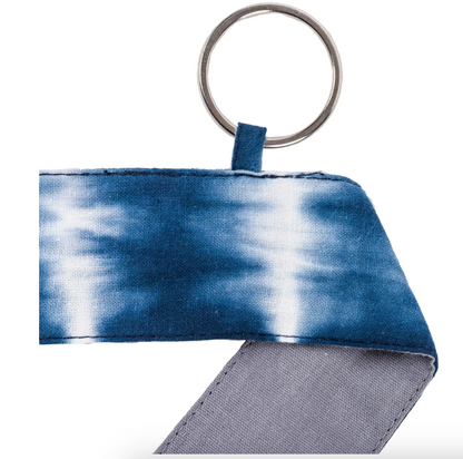 Close-up photo of Shibori Tie Dye Yoga Mat Strap with keyring