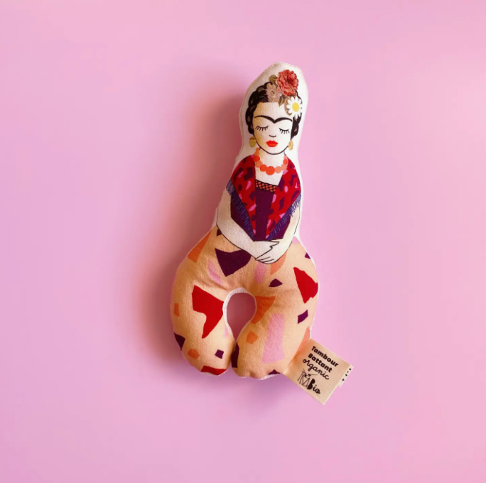 Soft fabric rattle with an illustration of Frida Kahlo.