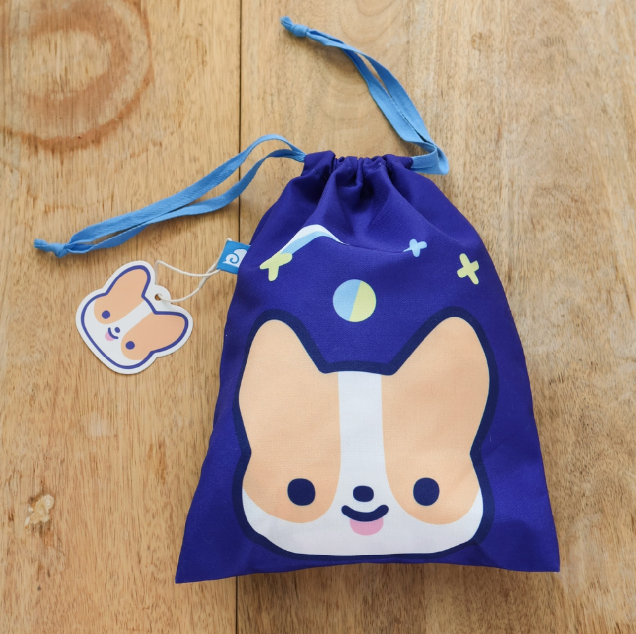 A travel-friendly, cute, versatile drawstring pouch bag with a Corgi.