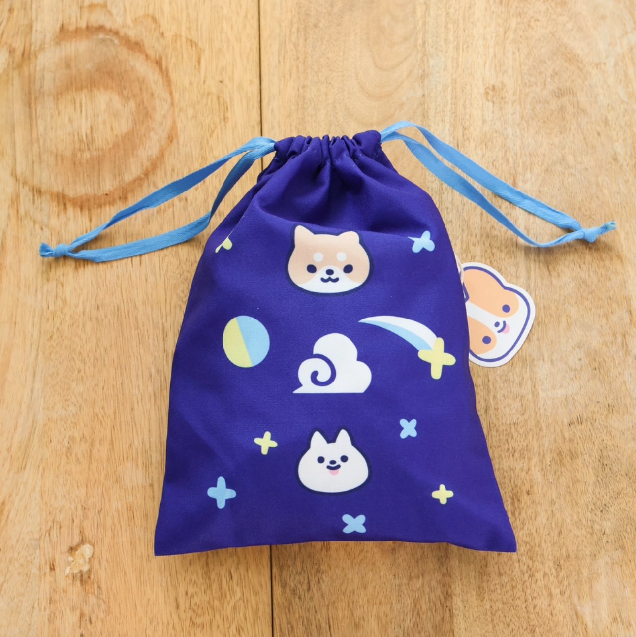 A travel-friendly, cute, versatile drawstring pouch bag with a Corgi