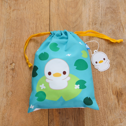 A travel-friendly, cute, versatile drawstring pouch bag with a duckling.