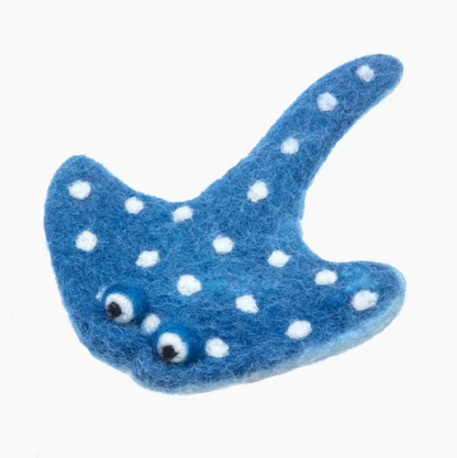 Blue felted fish with white polka dots on a white background