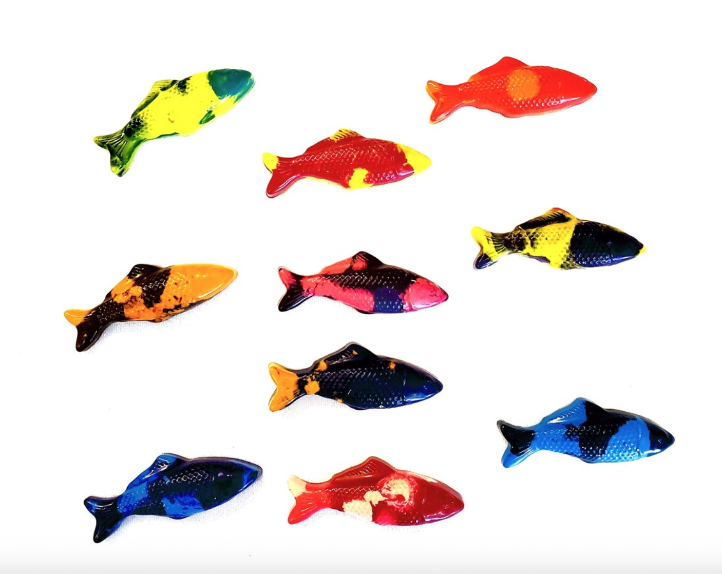 Colorful fish-shaped crayons on a white background