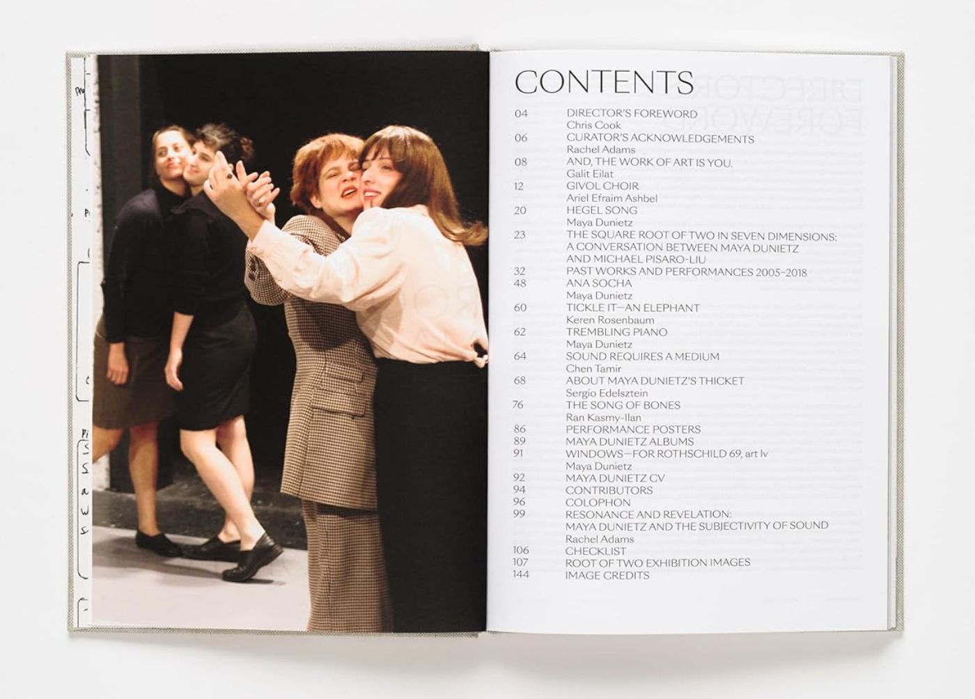 Open book showing a photograph of two women embracing and a list titled 'Contents' on a white background.