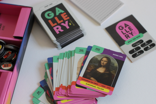 Card game 'Gallery' with cards and a box on a white surface