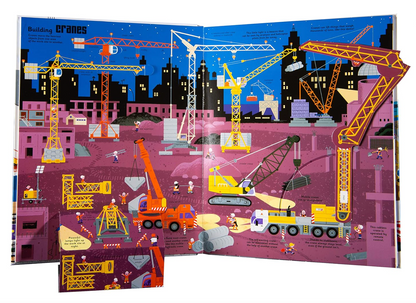 Illustrated book open to pages showing cranes and construction vehicles on a cityscape background.