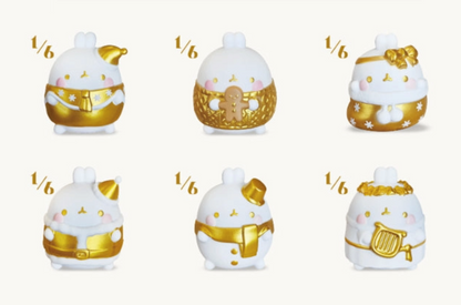 Set of six small figurines with gold and white details on a white background