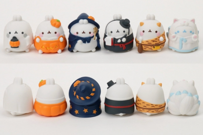 Collection of cute figurines with various Halloween designs on a white background