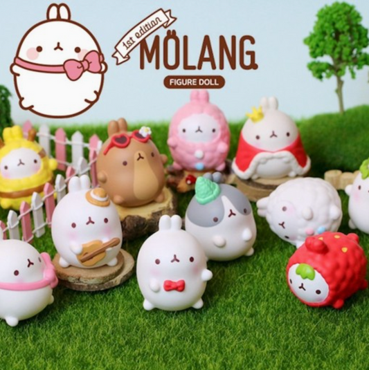Molang figures dressed up with a grassy background and tree