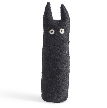Black plush figure with a minimalist design on a white background