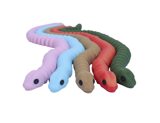 Set of colorful snake-shaped toys on a light gray background