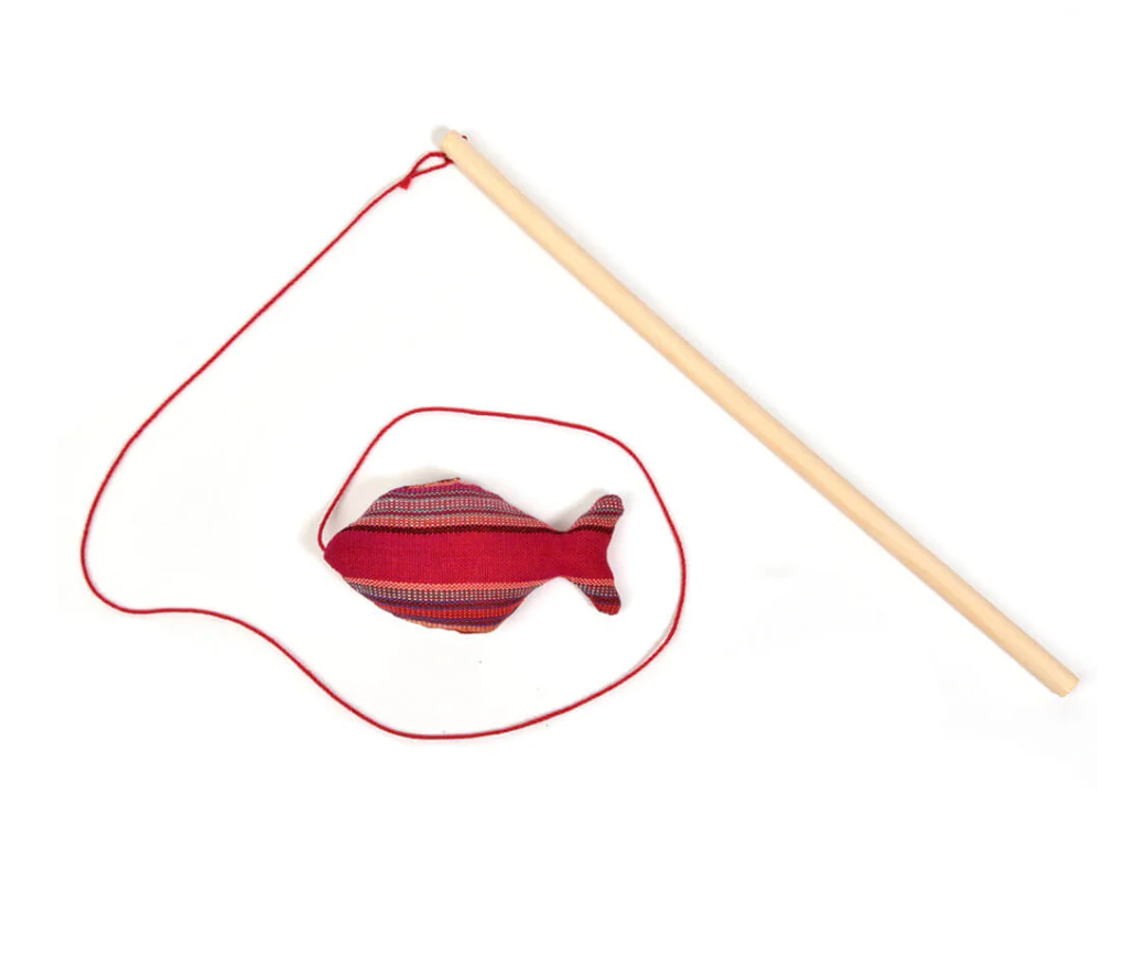 Red Cat fish toy with a string and wooden rod on a white background