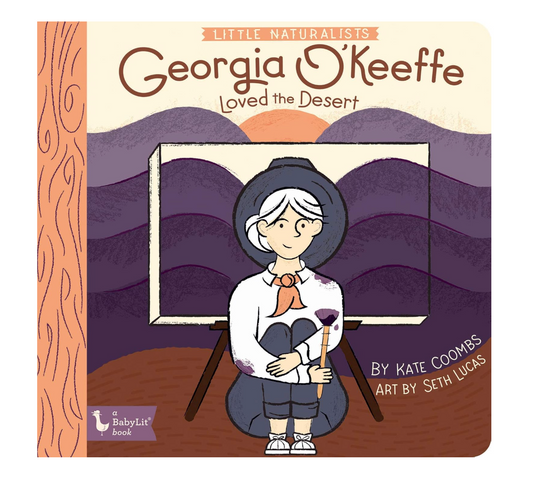 Front cover of the children's book 'Little Naturalists: Georgia O'Keefe Loved the Desert' by Kate Coombs and Seth Lucas, published by BabyList Book. The cover features a colorful illustration of a woman painting a desert landscape on an easel.