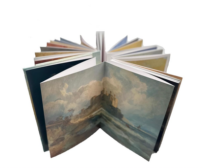 Open book with artistic illustrations on a white background.