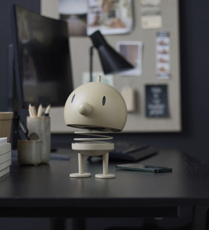 Hoptimist Speaker on a desk with a computer setup in the background