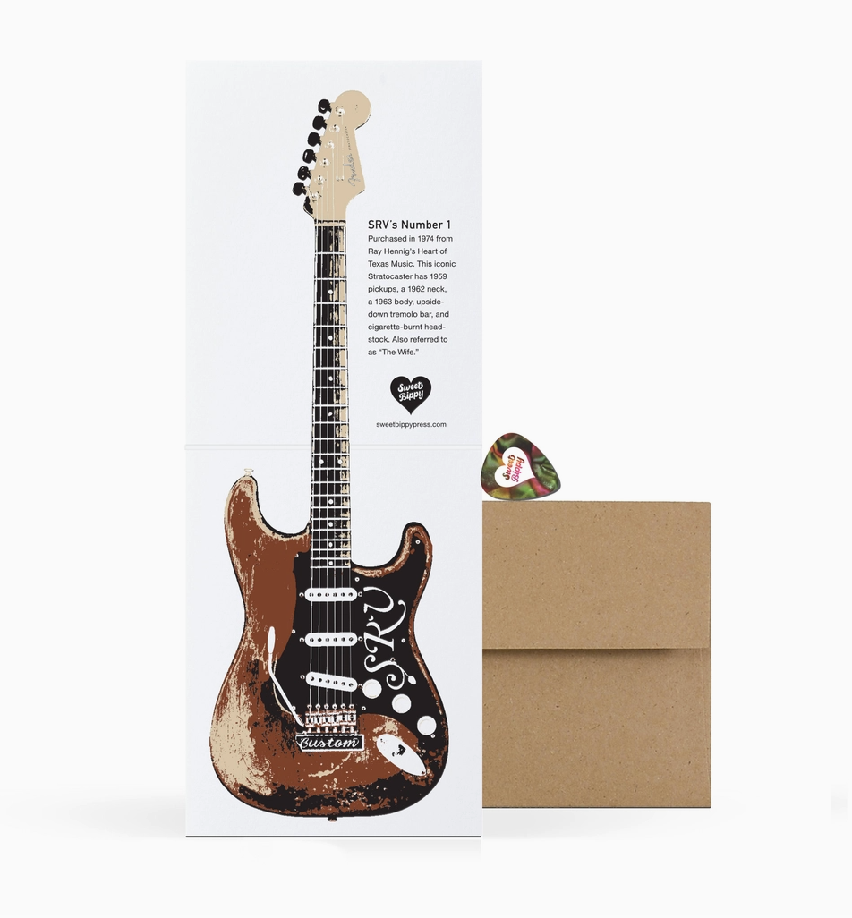 Guitar-shaped card with a guitar pick and envelope on a white background