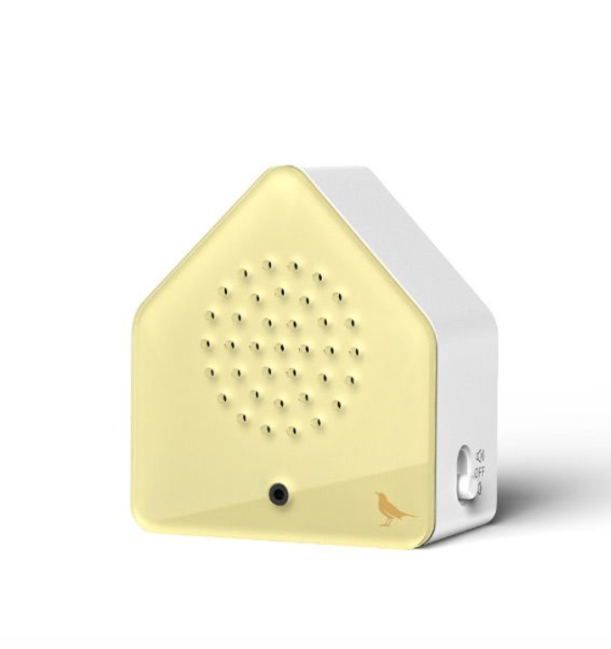Small triangular sound box with a beige front and white sides on a white background