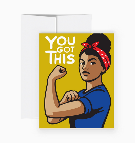 A greeting card featuring a stylized illustration of Rosie the Riveter flexing her bicep with the text 'YOU GOT THIS' on a mustard yellow background, shown with a white envelope behind it.