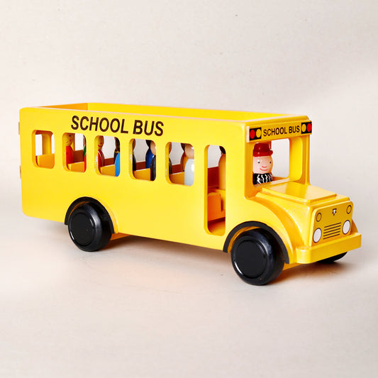 Yellow toy school bus with a driver figure on a light gray background