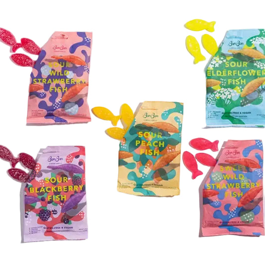 Colorful packages of Sour Fish snacks on a white background
