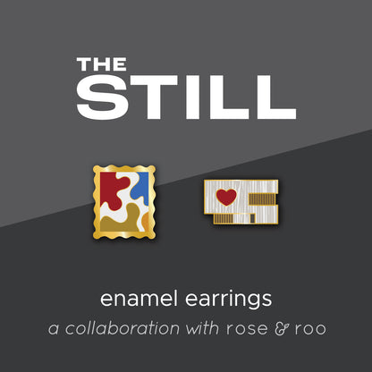 Enamel earrings of the Clyfford Still Museum building and a painting