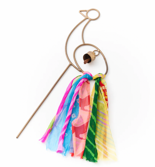 Garden Swapna stake with bell. Metal garden stake chime in unique peacock design which features a handcrafted bell, vibrant assorted recycled sari tassels, and sturdy grounding stake. 