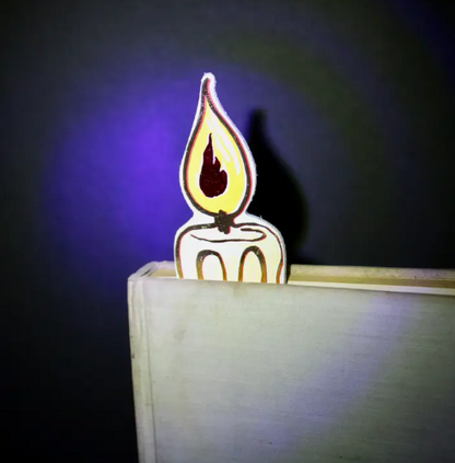 “You're flaming great” leather candle bookmark in white.