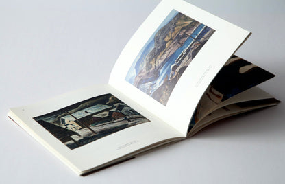 Photograph of ‘Clyfford Still: The Colville Reservation and Beyond, 1934-1939’ flipping through pages.